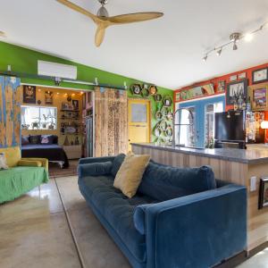 Living room and view into bedroom