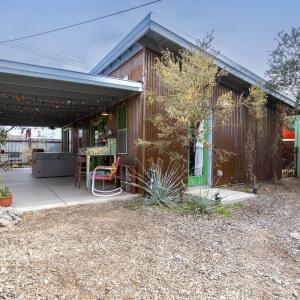 Casita exterior including covered north porch and vegetation