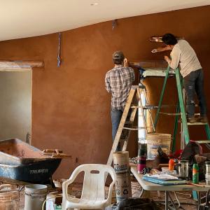 Finish plastering interior earth block wall