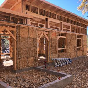 Strawbale home in progress w/ exposed strawbales 