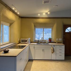 Kitchen w/ rounded openings and clay plaster