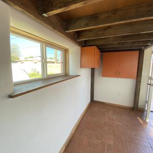 Under-loft view w/ salvaged cabinets and lumber