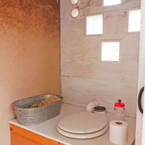 Site-built composting toilet uses durable high-density polyethylene top (HDPE) and salvaged materials. Toilet permitted by Arizona Department of Environmental Quality.
